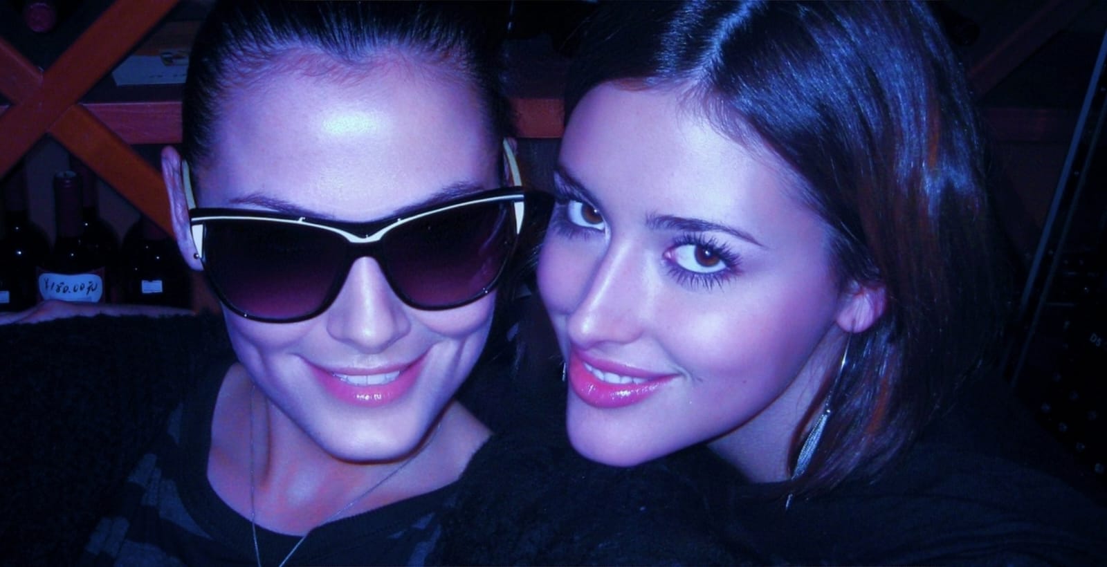 Katya and April sunglasses in a bar